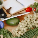 A vibrant composition of fruits, vegetables, and fitness items promoting a healthy lifestyle.